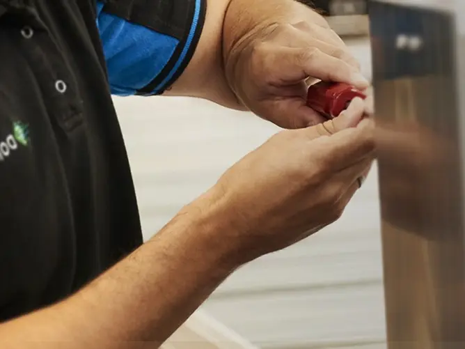 domino man repairing broken domino printer