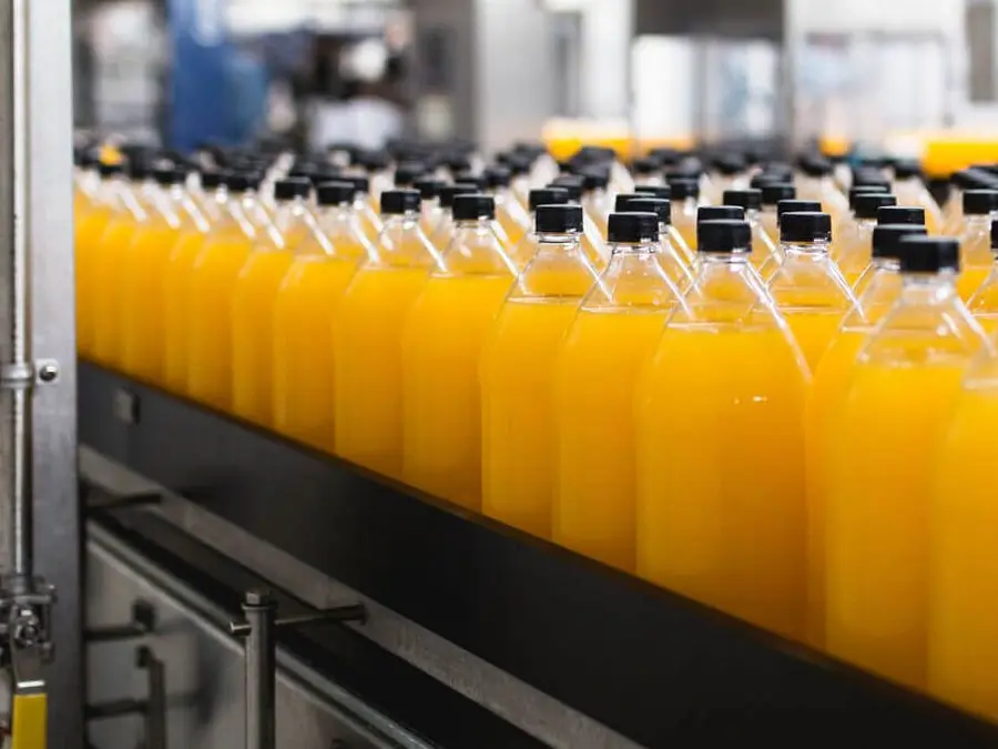 orange juice bottles conveyer